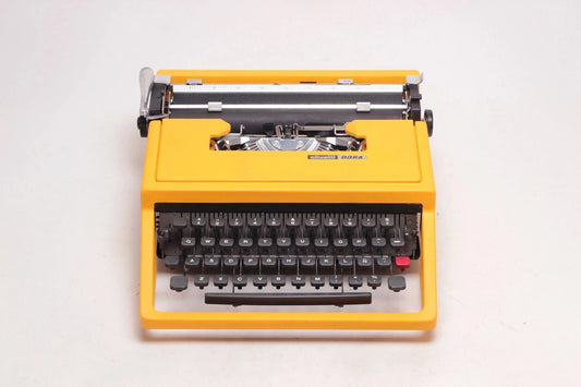 SOLD! Olivetti Dora Yellow, Vintage Manual Typewriter, Refurbished - ElGranero Typewriter.Company