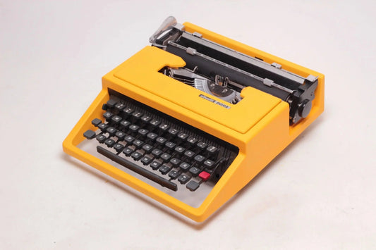 SOLD! Olivetti Dora Yellow, Vintage Manual Typewriter, Refurbished - ElGranero Typewriter.Company