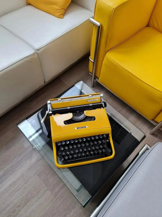 Olivetti Pluma 22, Pro Yellow Manual Vintage Typewriter, Restored - ElGranero Typewriter.Company