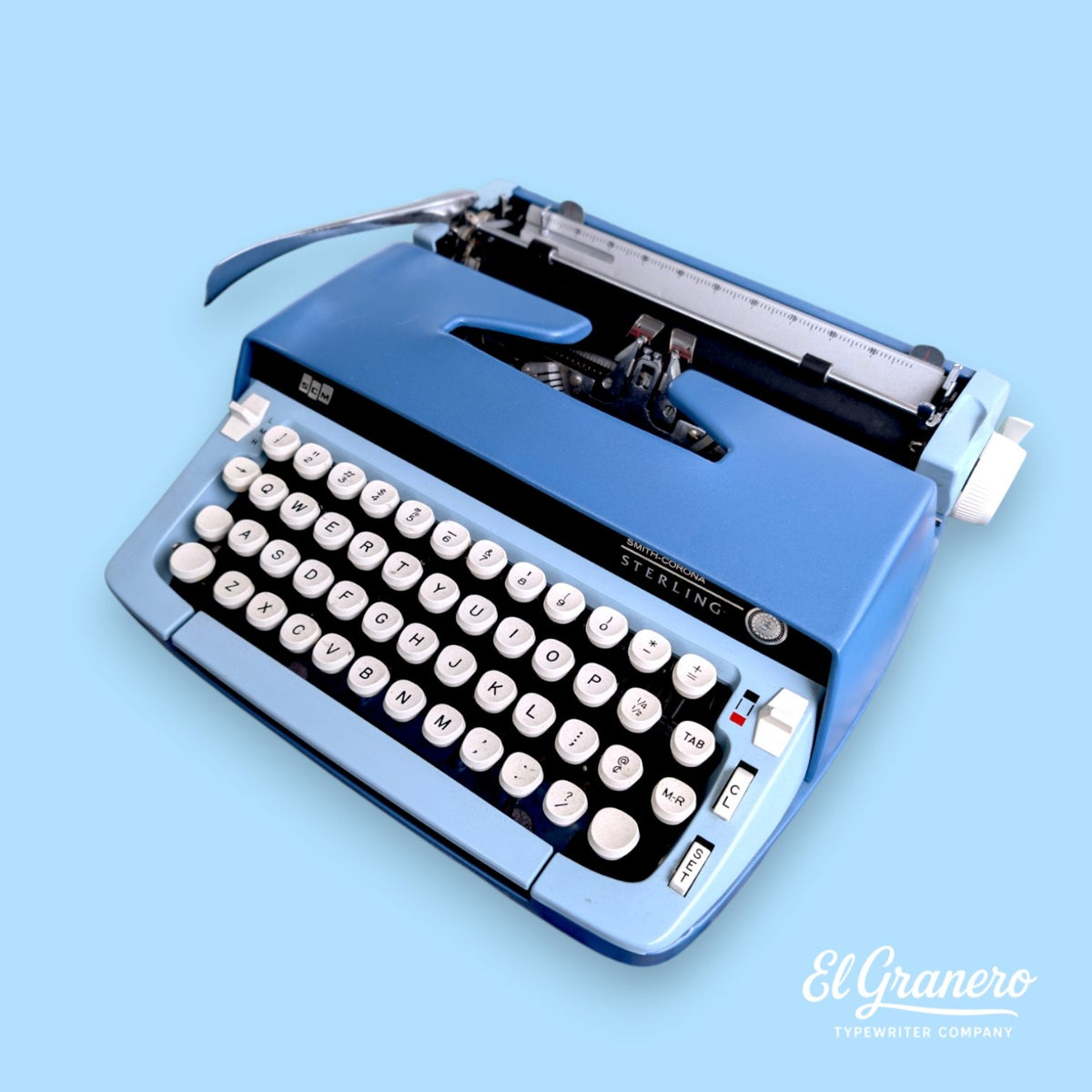Smith-Corona Sterling blue vintage manual portable typewriter, front three-quarter view