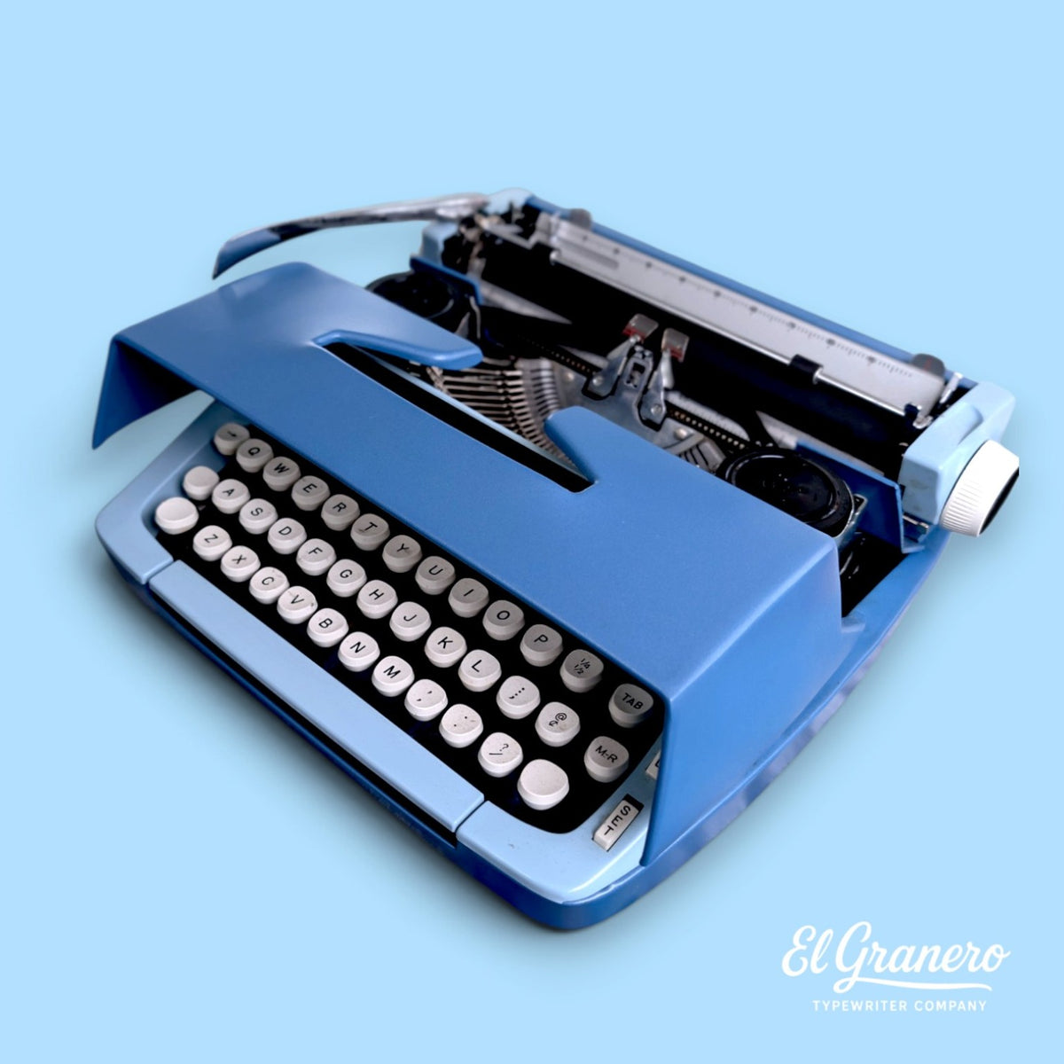 Smith-Corona Sterling blue vintage typewriter with ribbon cover open