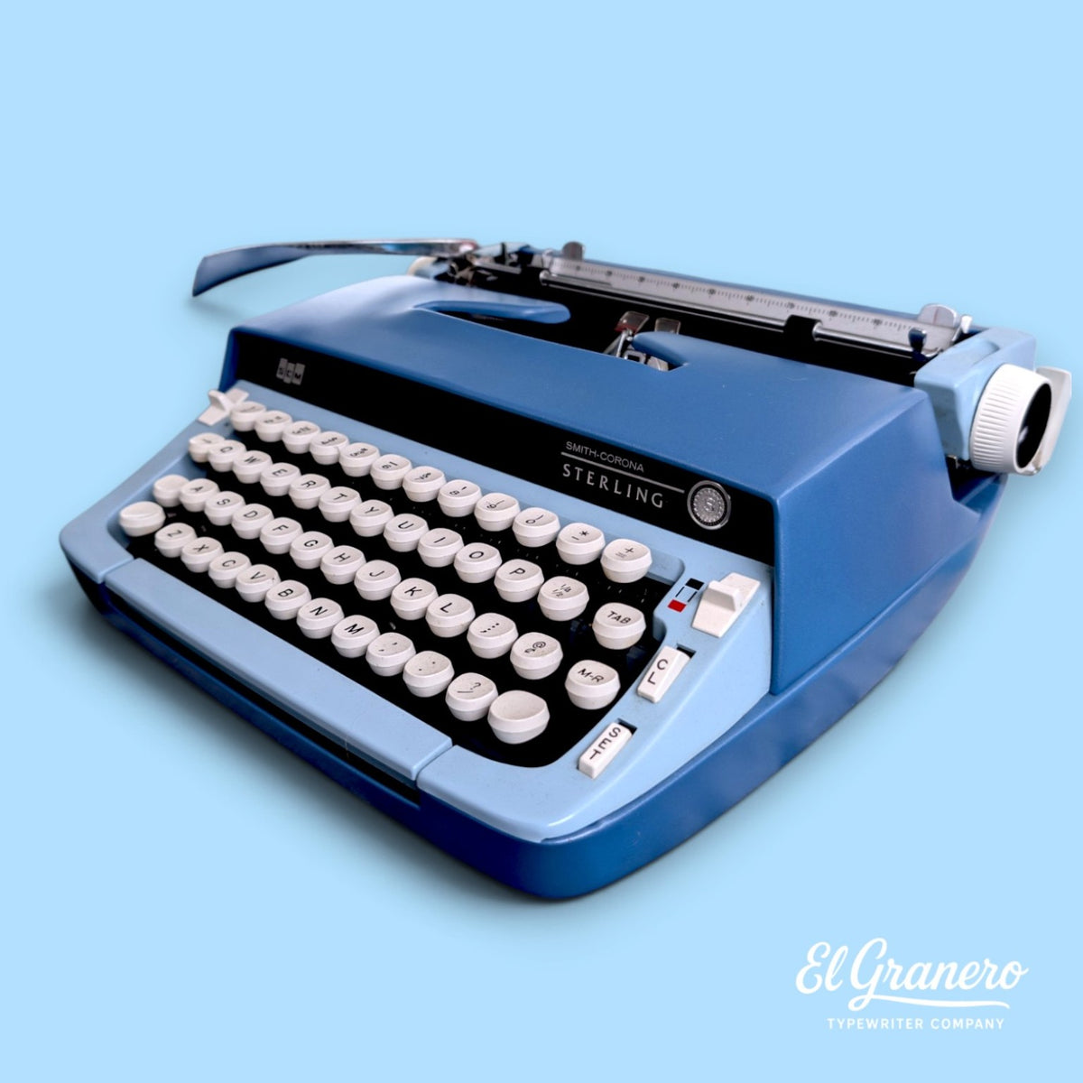 Smith-Corona Sterling blue vintage manual typewriter, side three-quarter view